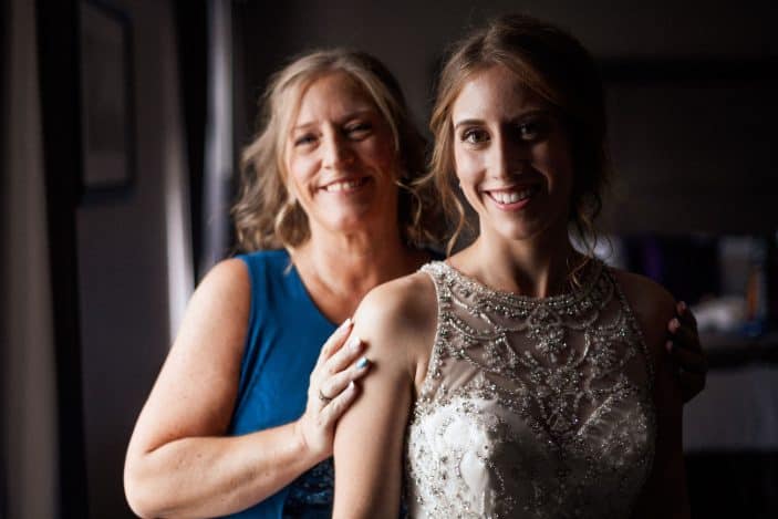 bride and mother smiling