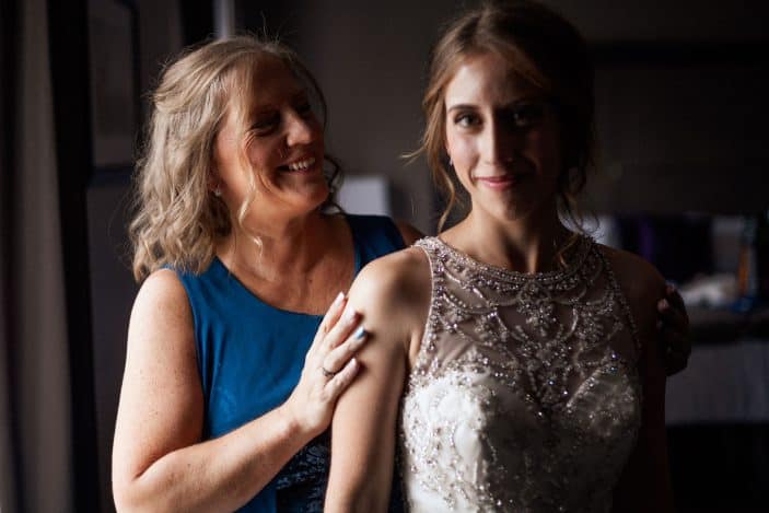 bride and mother smiling