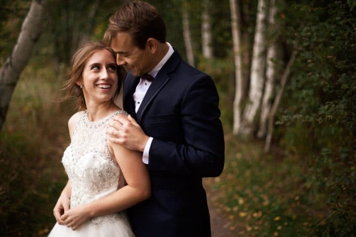 bride and groom laughing