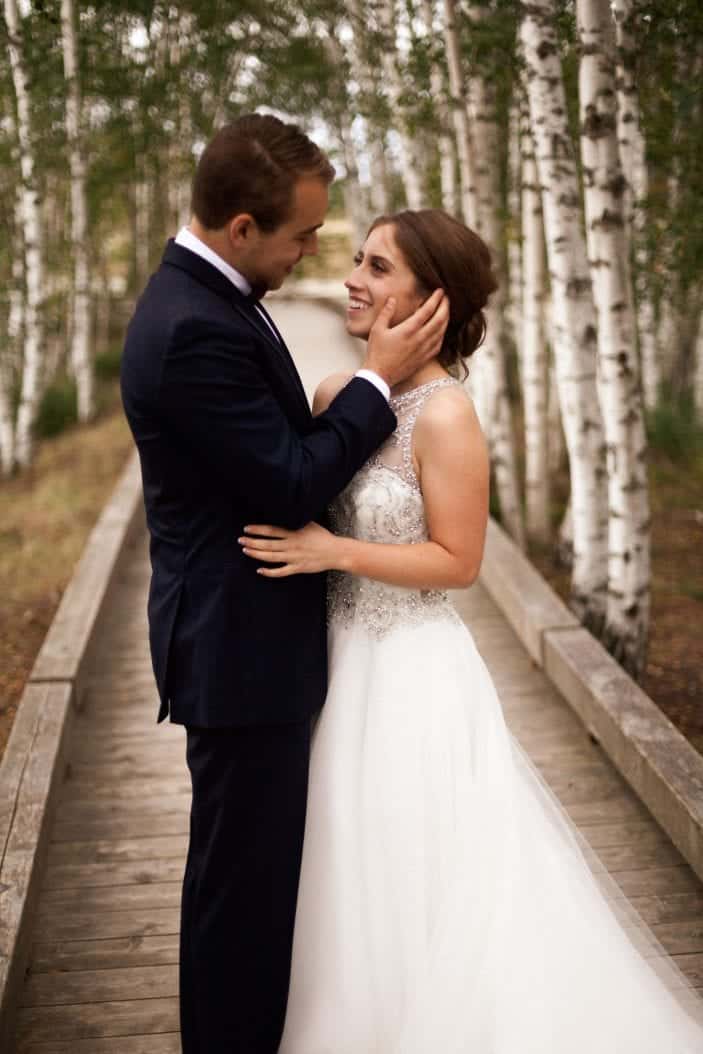 bride and groom looking at each other - cozy fall wedding