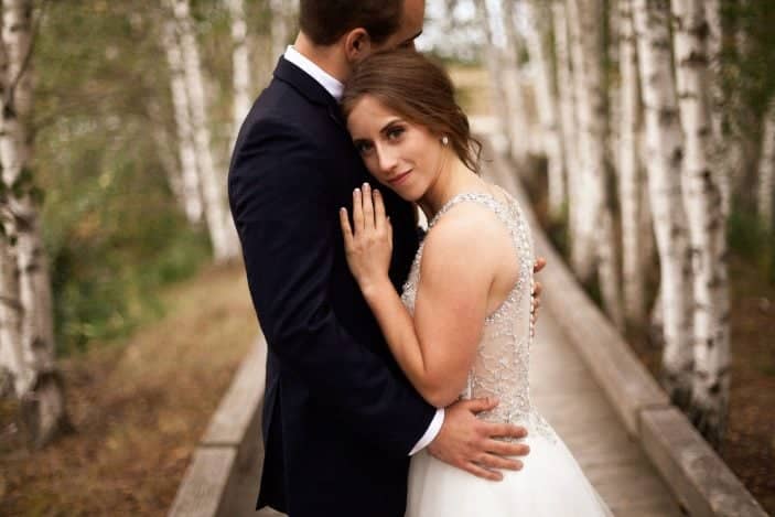 bride leaning on groom - cozy fall wedding