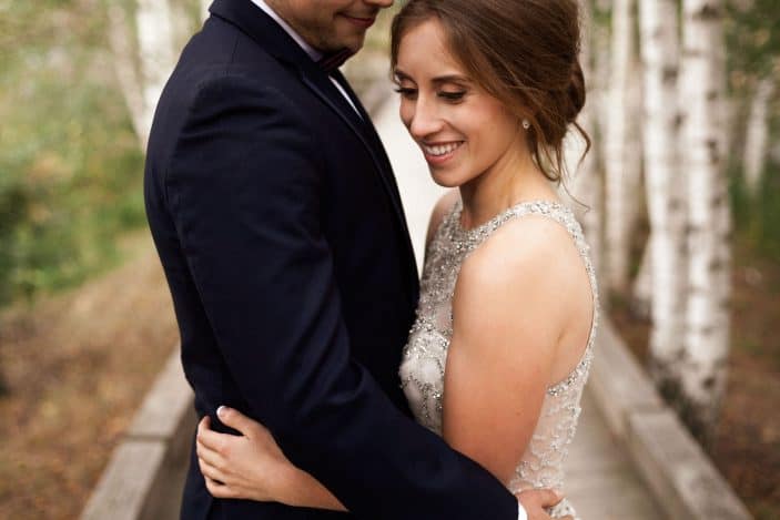 bride and groom hugging - cozy fall wedding