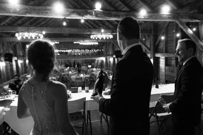 bride and groom overlooking the barn interior