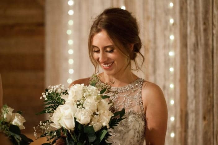 bride looking at flowers