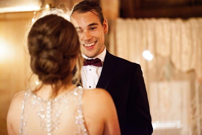 groom looking at bride