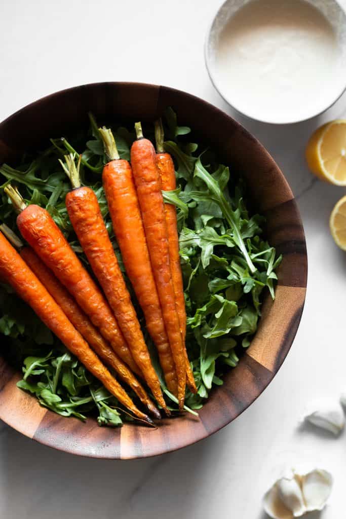 arugula and roasted carrots in a bowl