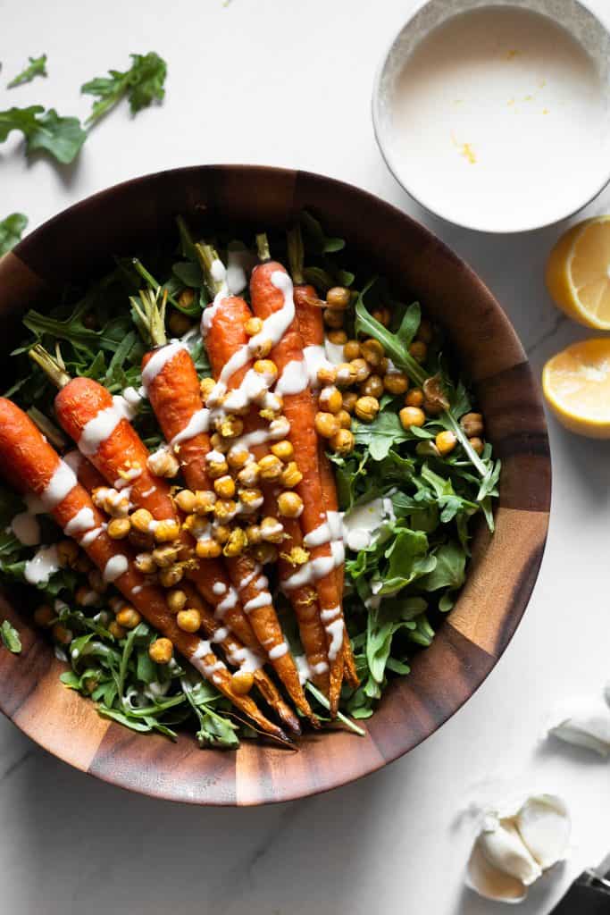 carrot and arugula salad in a bowl