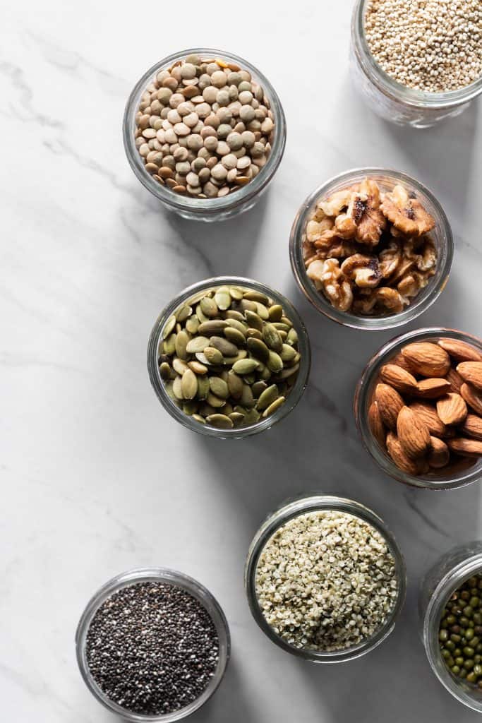 beans, nuts and seeds in jars from the top