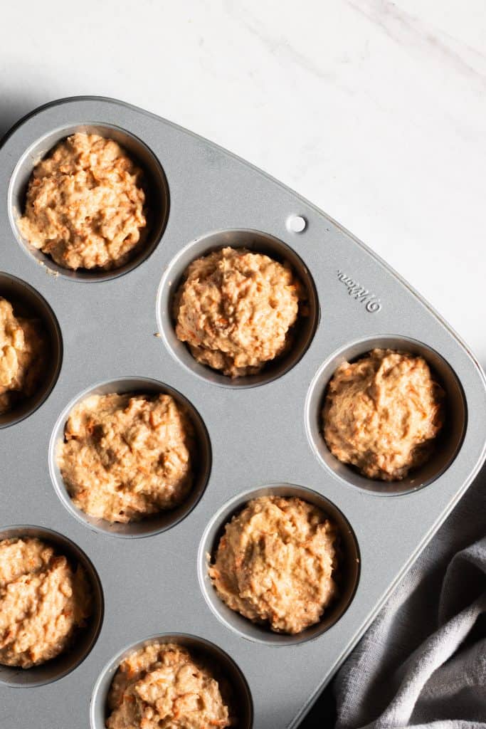 maple carrot muffins in muffin tin