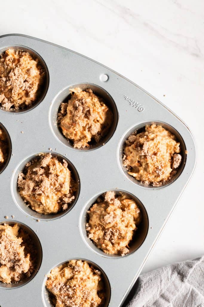 maple carrot muffins with streusel in muffin tin