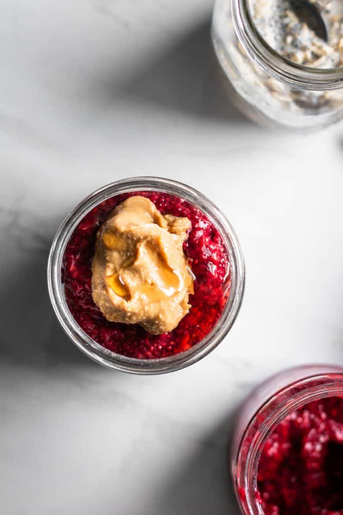 peanut butter & jelly overnight oats in jars from the top