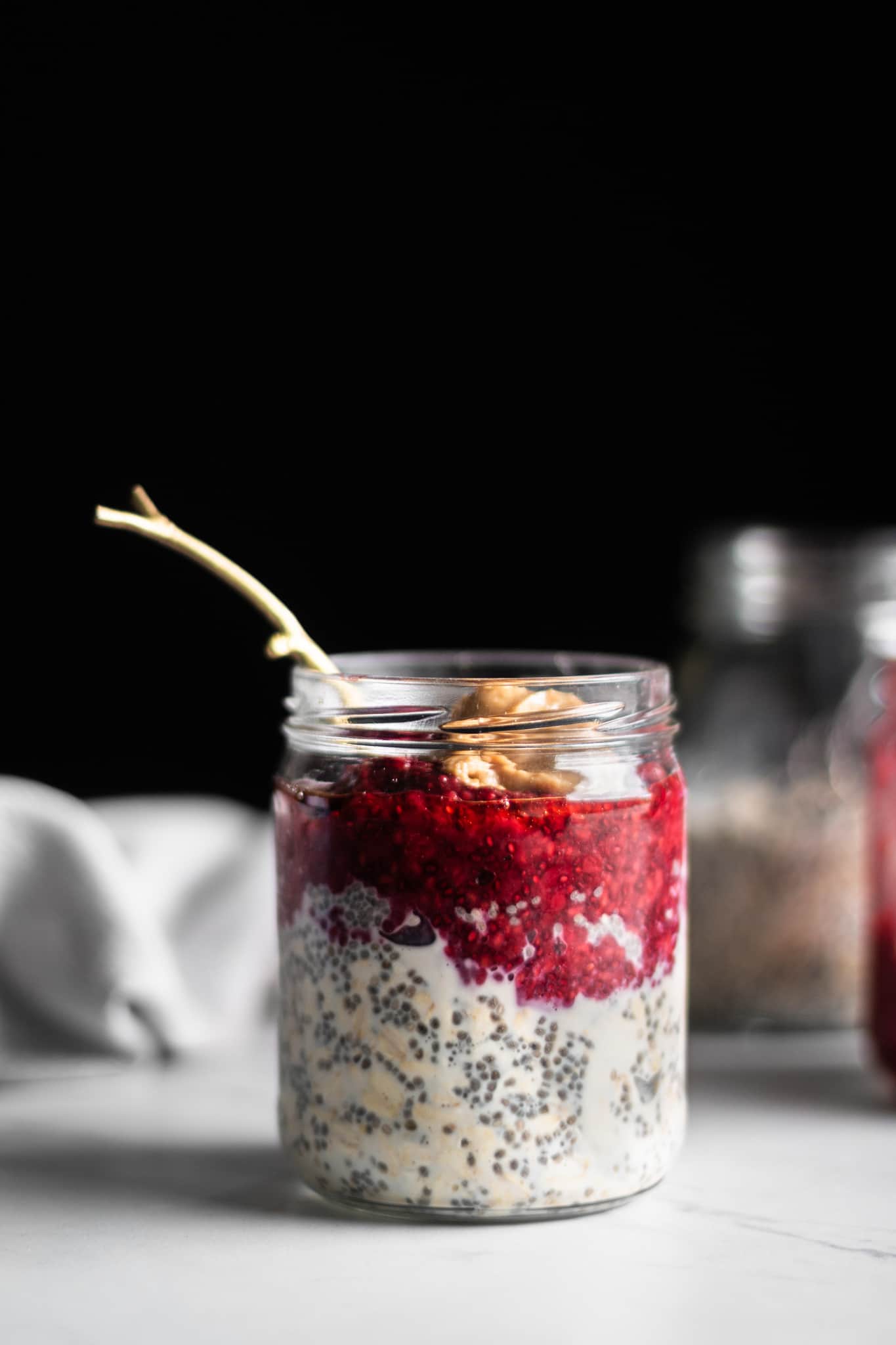 peanut butter and jelly overnight oats in a jar