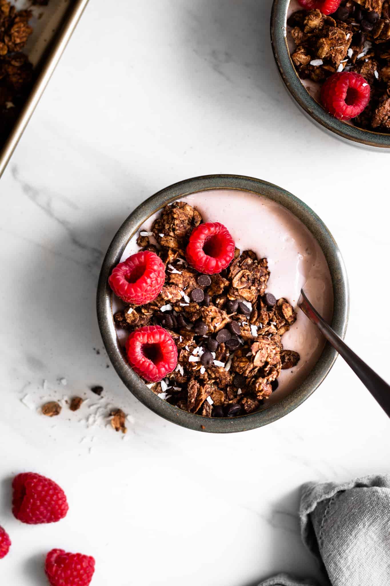 chocolate almond granola in a bowl with yogurt