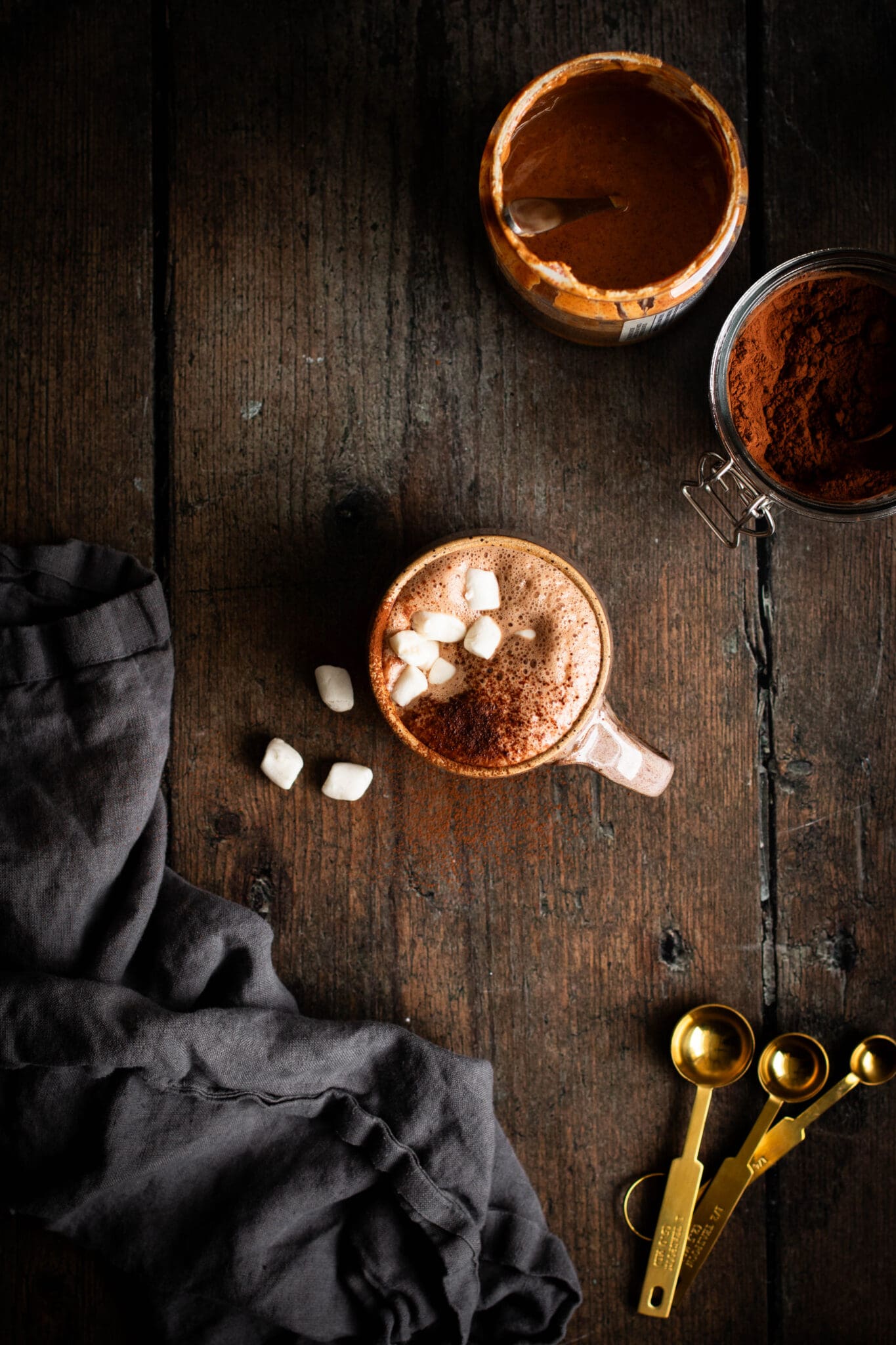 Vegan maple hot cocoa in a mug with marshmallows.