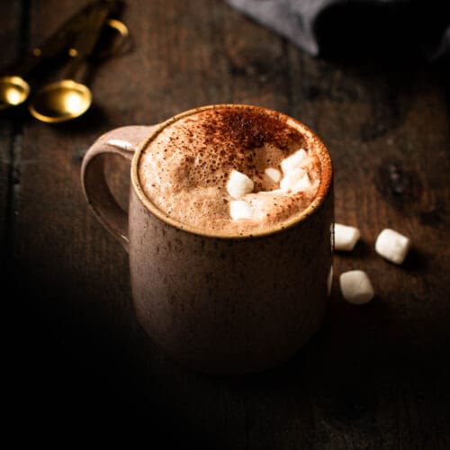 Vegan salted maple hot cocoa in a mug with marshmallows.