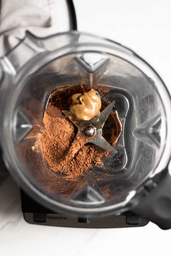 cocoa powder, sunflower seed butter and maple syrup in a blender