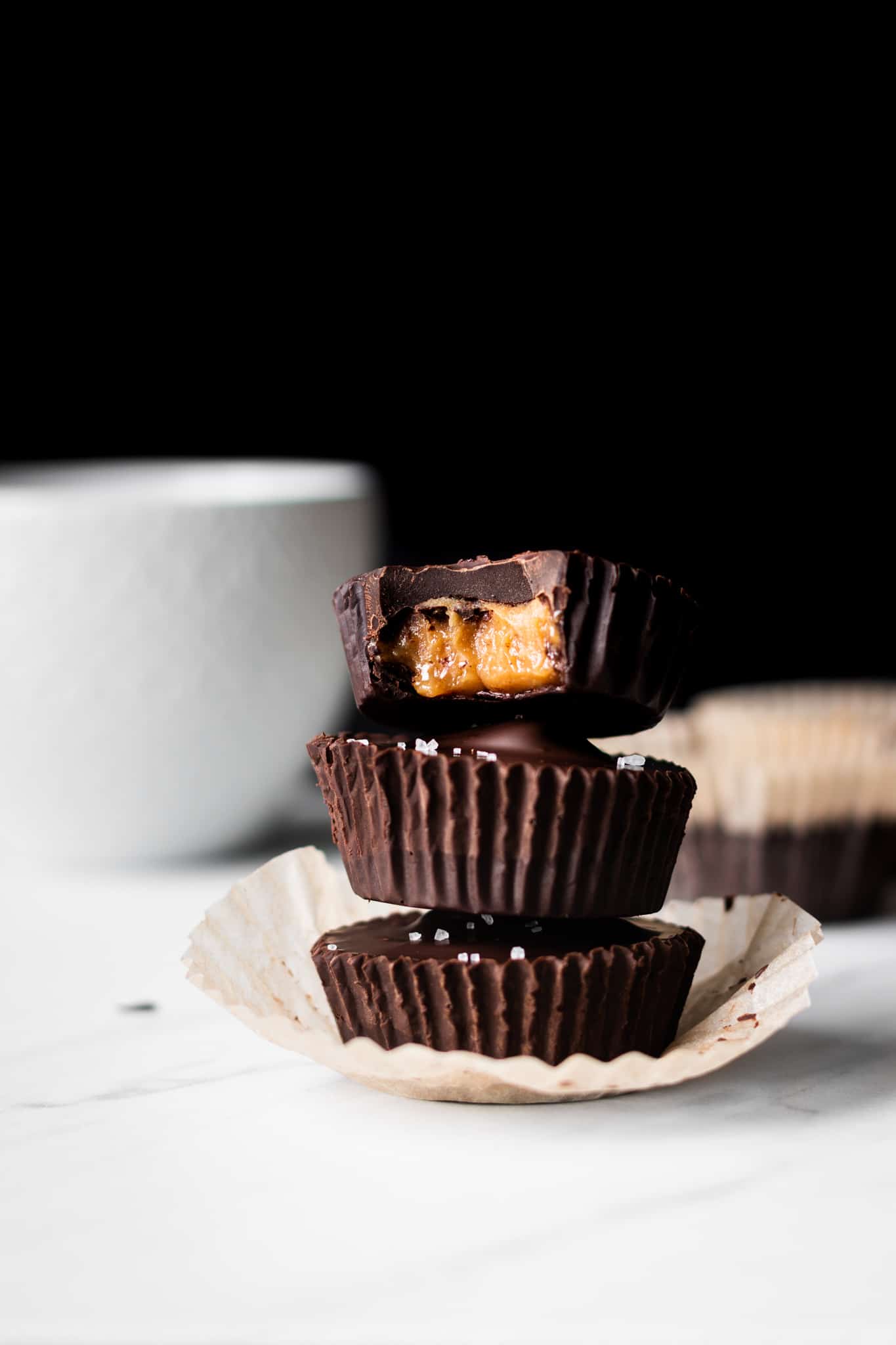 chocolate caramel peanut butter cups stacked 