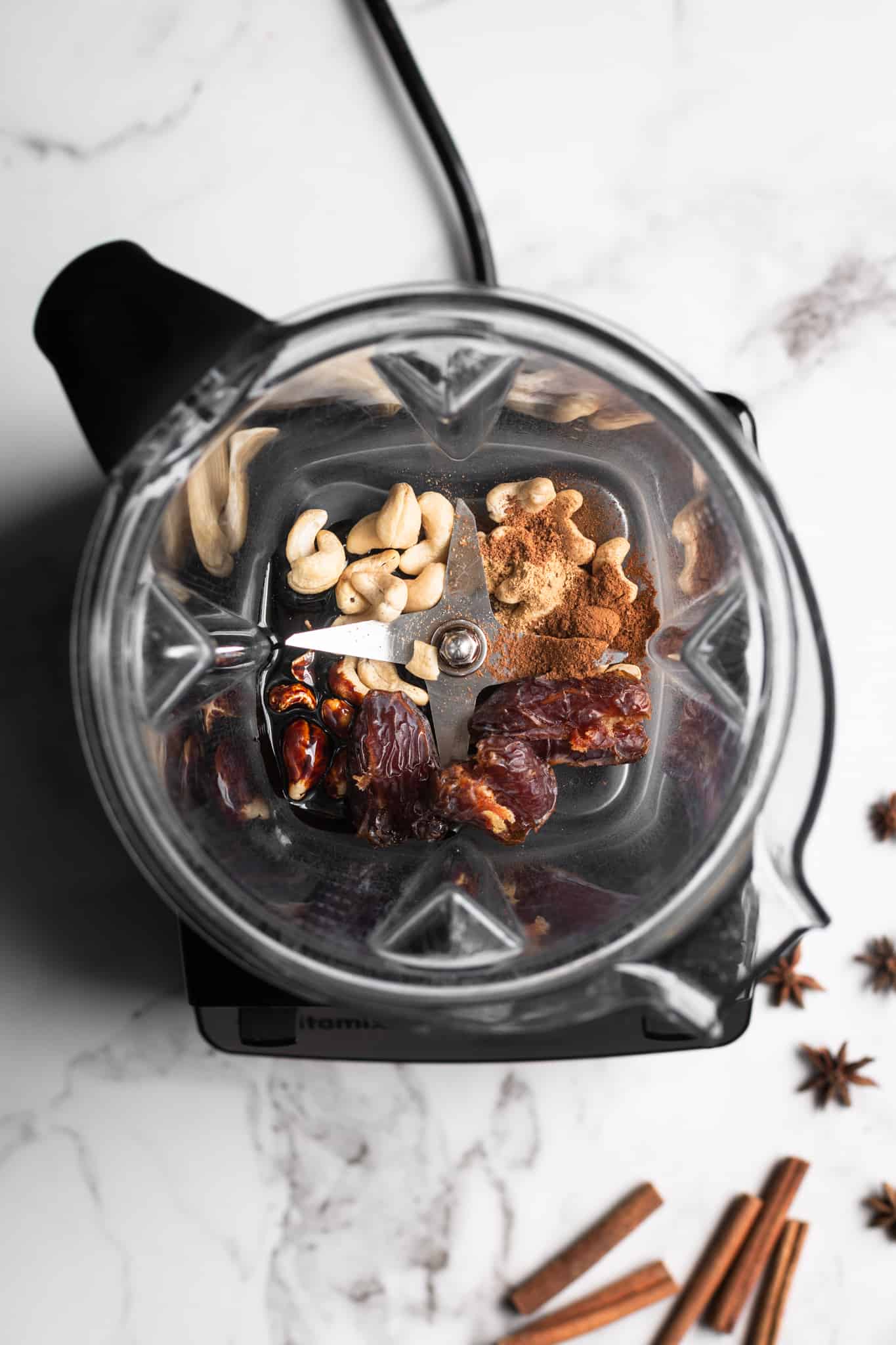 dates, cashews and spices in a blender