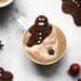 gingerbread latte in a cup with gingerbread men
