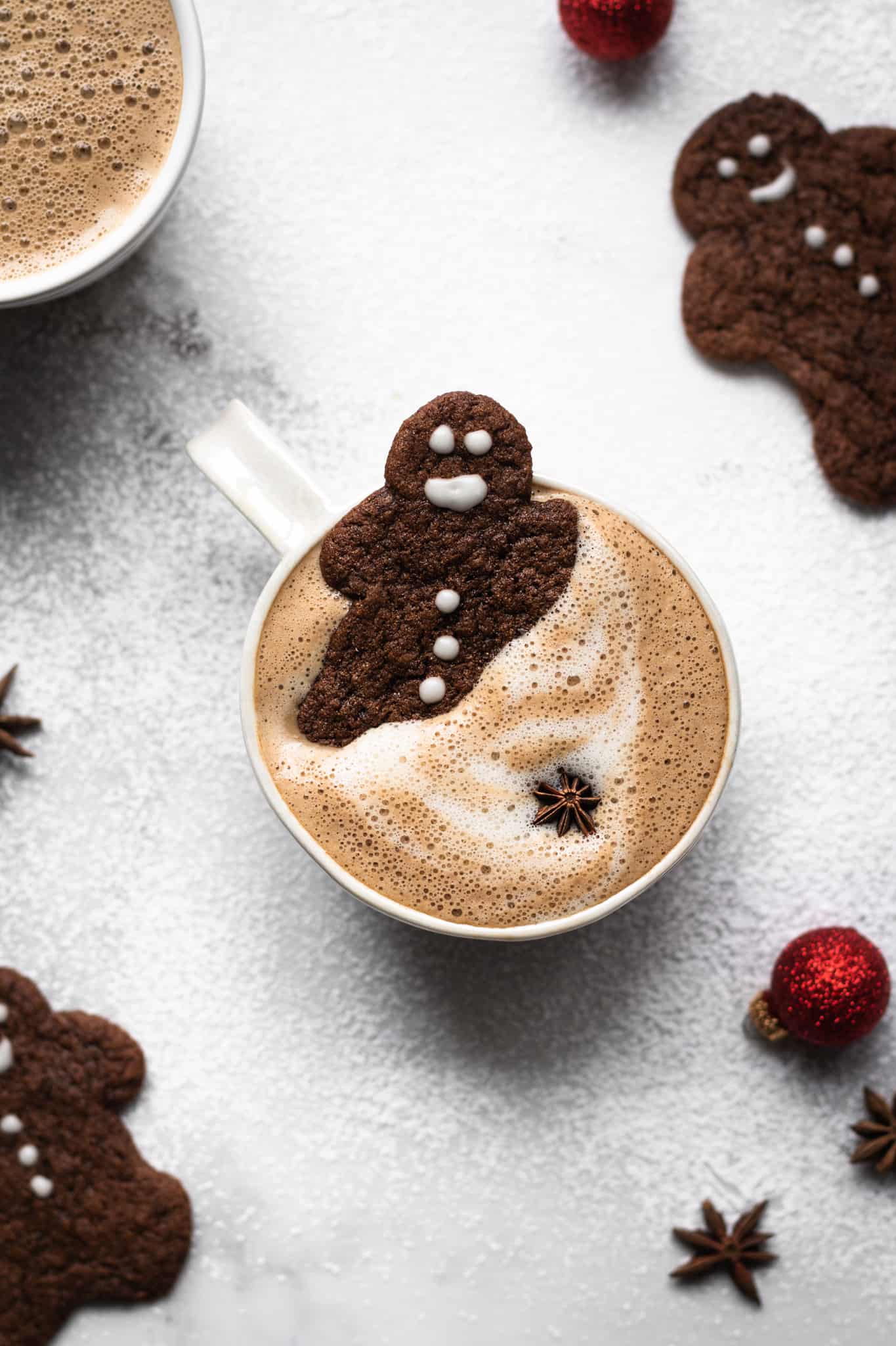 gingerbread latte in a cup with gingerbread men