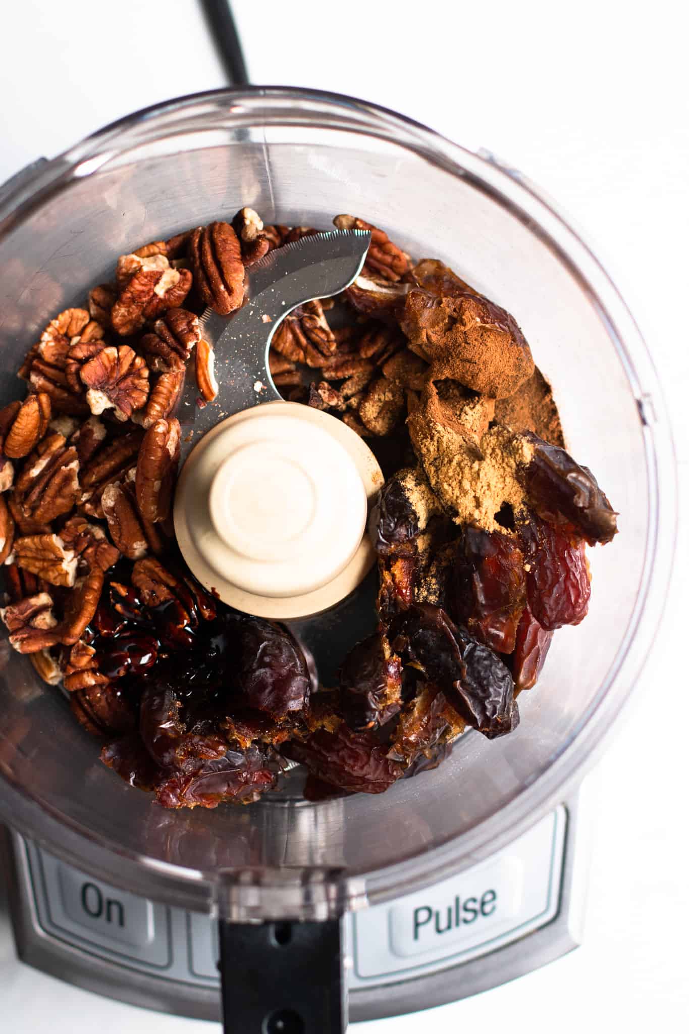 dates, pecans and spices in a food processor