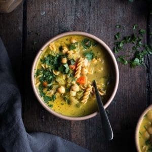 creamy chickpea noodle soup in a bowl