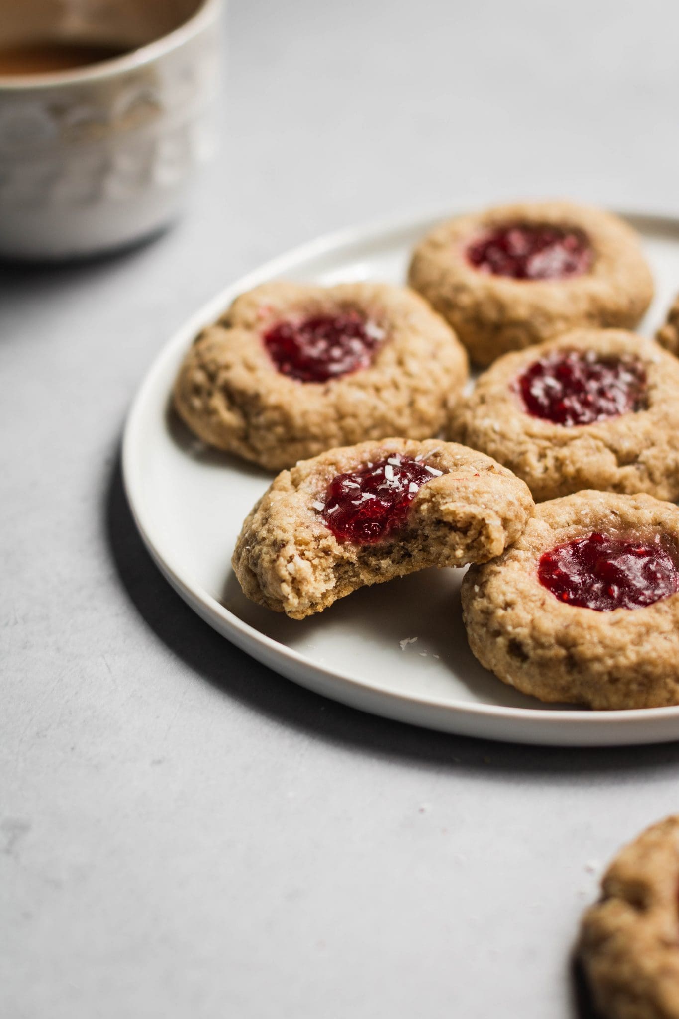vegan raspberry thumbprint cookies with bite taken