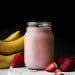 strawberry banana oat smoothie in a jar