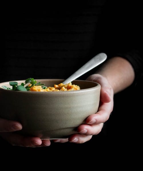 hands holding a bowl of soup - tips to improve your health without dieting