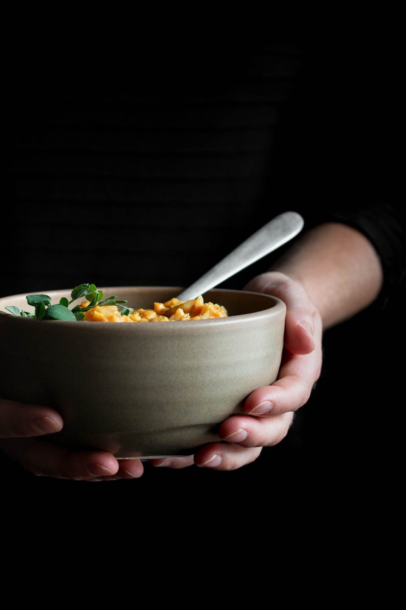 hands holding a bowl of soup - tips to improve your health without dieting