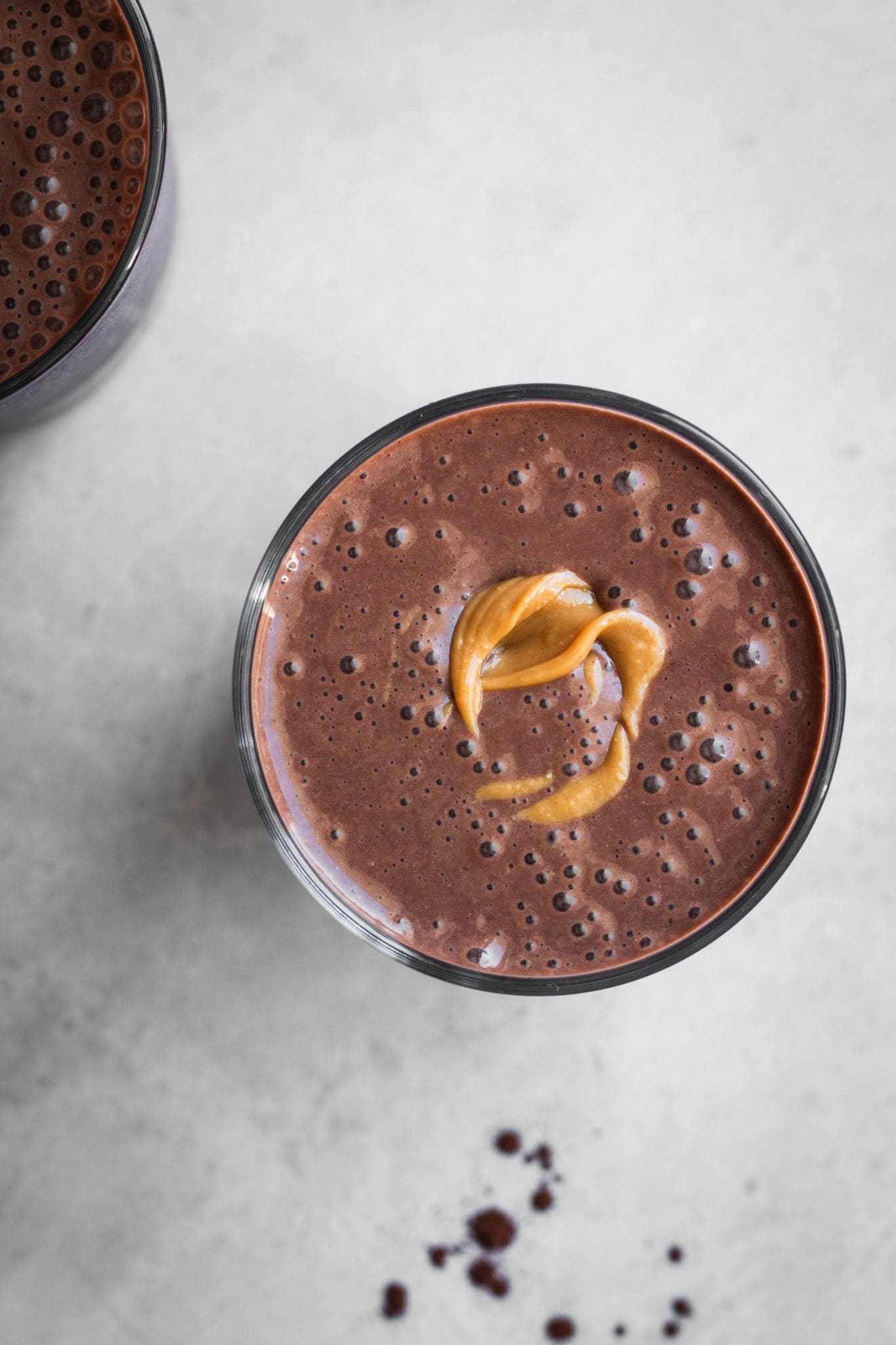chocolate smoothie in a glass with peanut butter
