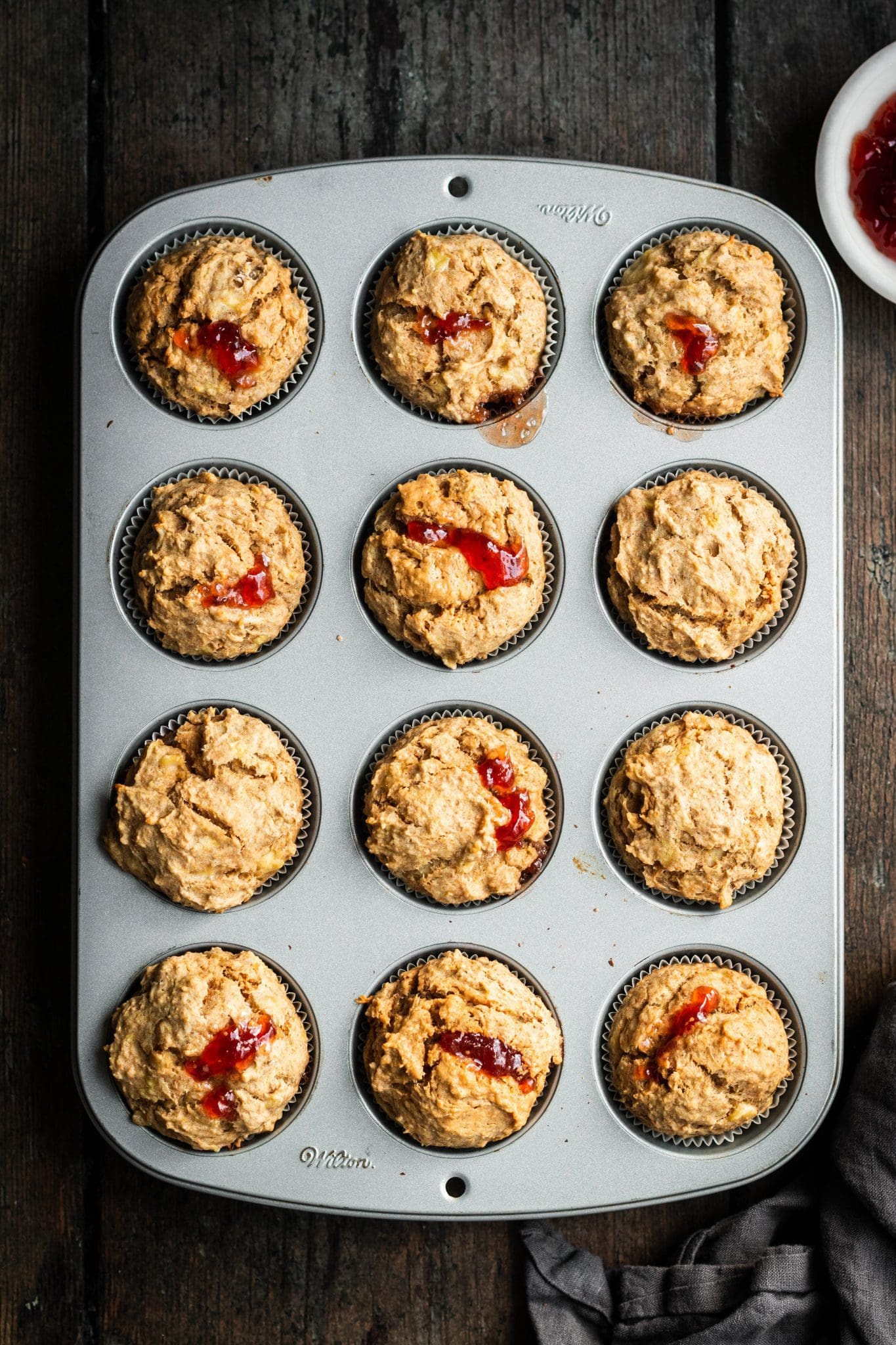 peanut butter and jelly muffins in muffin tins