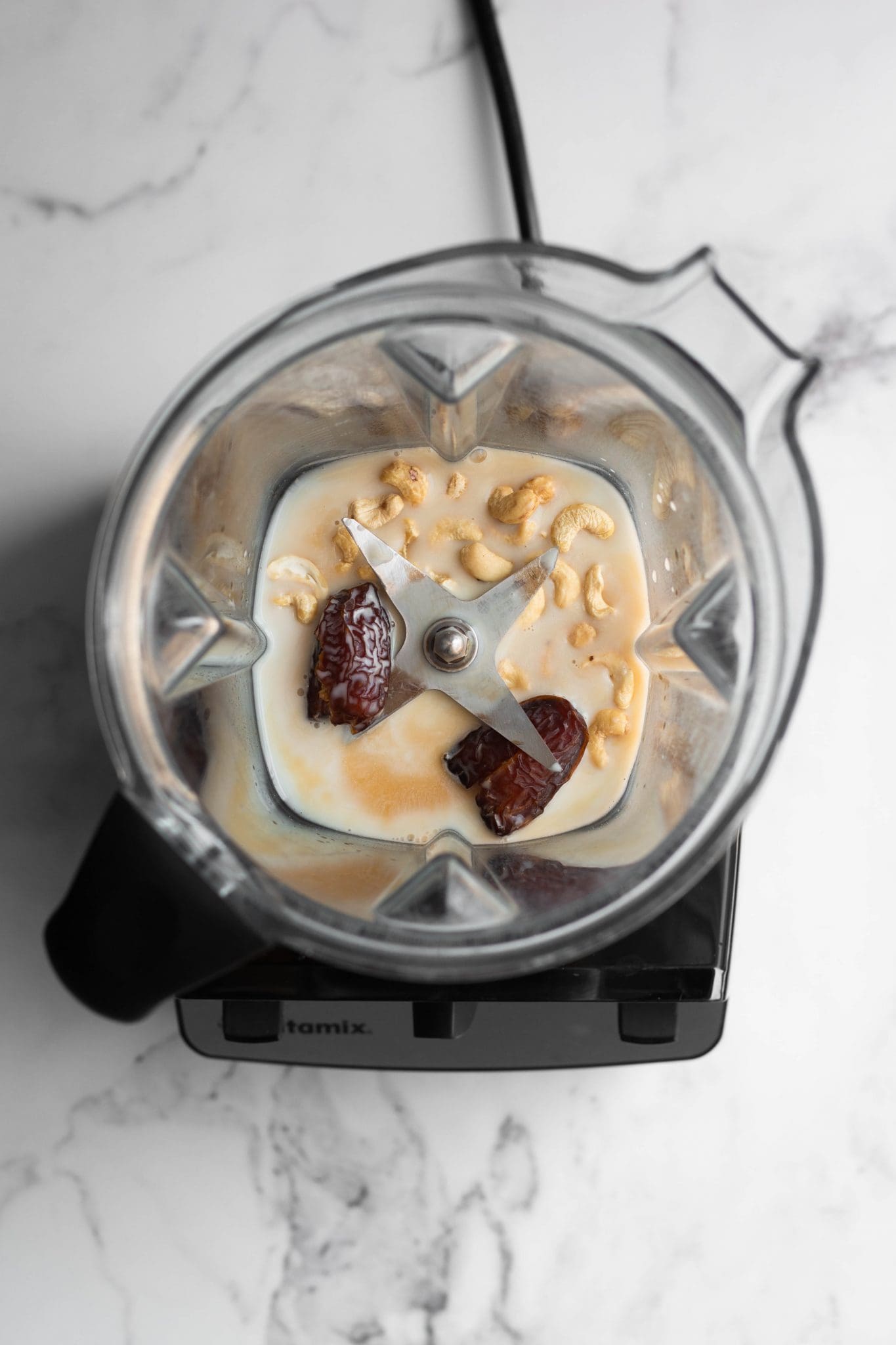 dates, cashews and milk in a blender