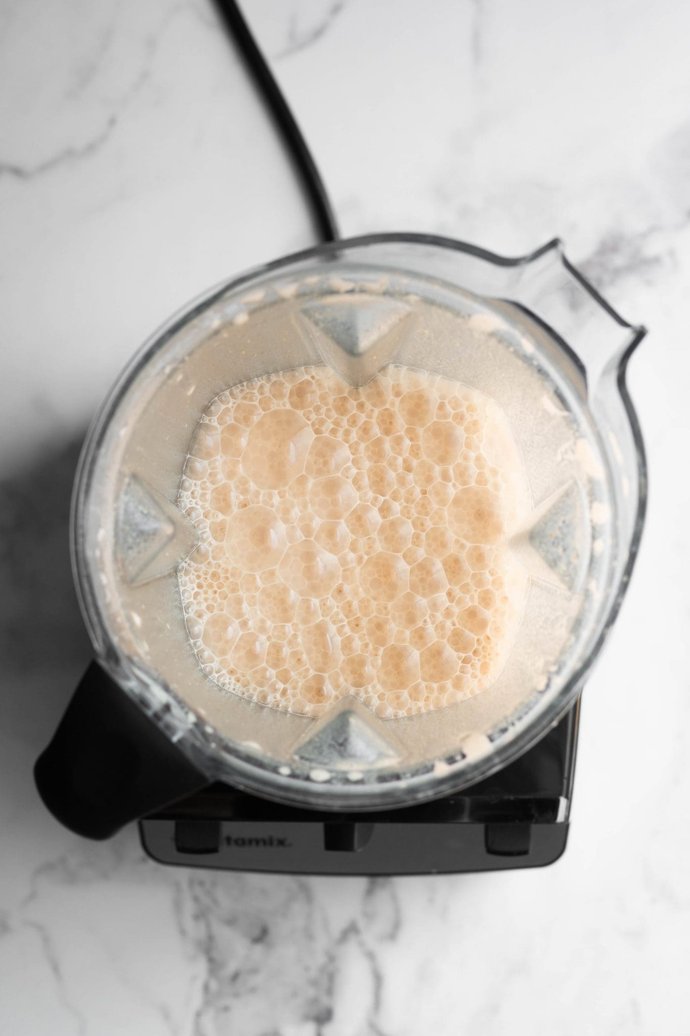 frothy latte in a blender