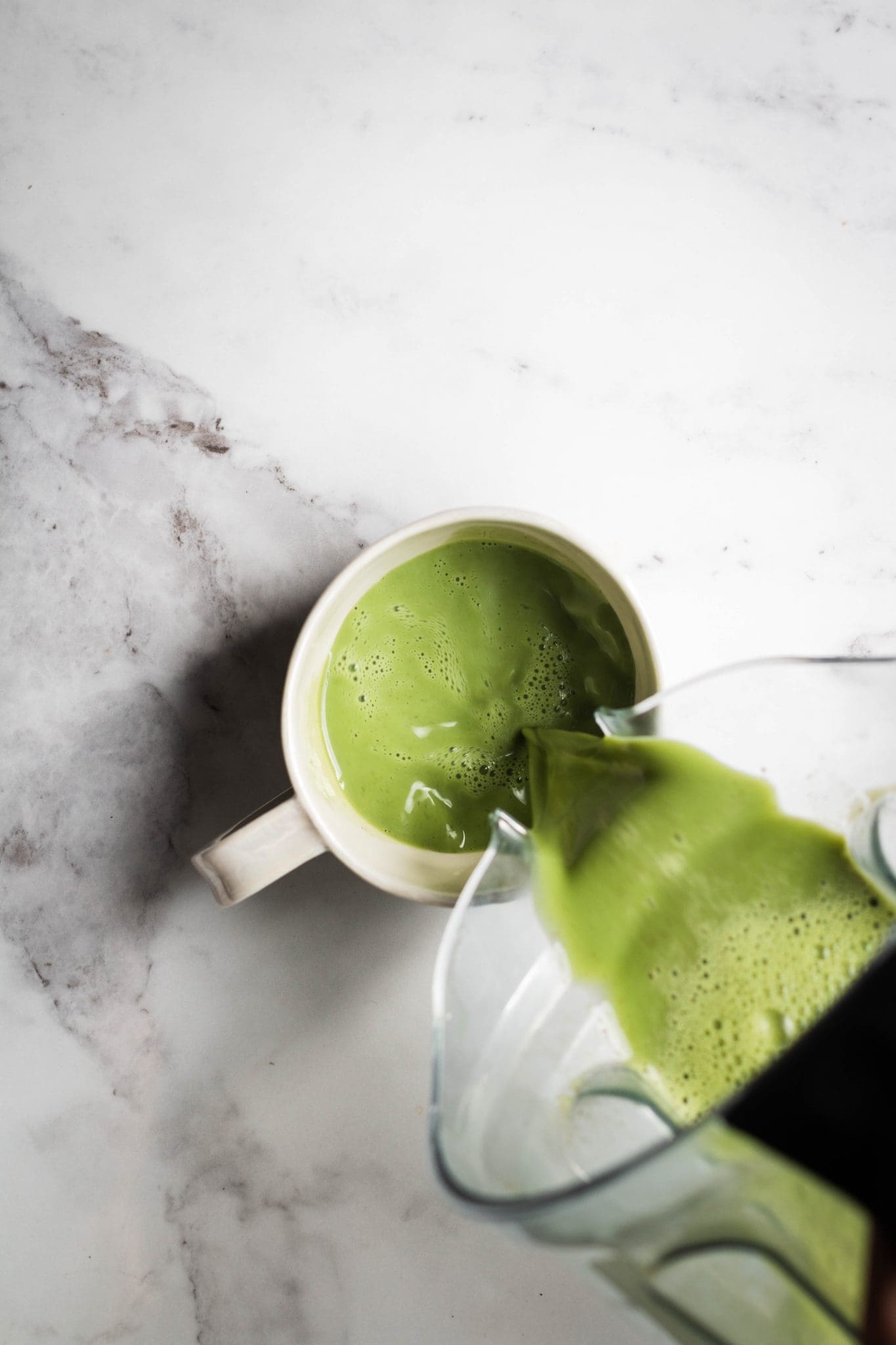 blender matcha latte poured in a cup