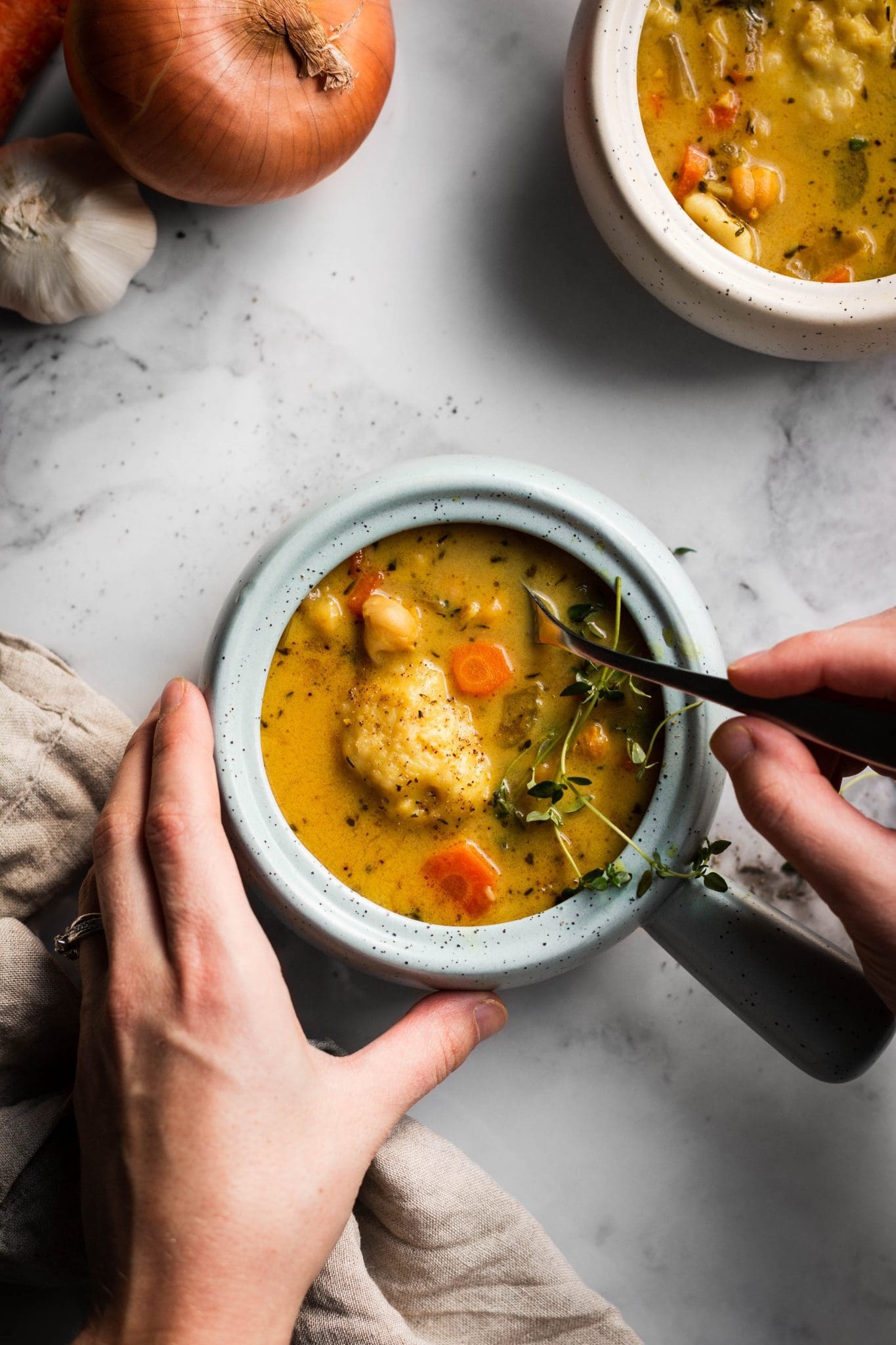 chickpea and dumpling soup in bowls