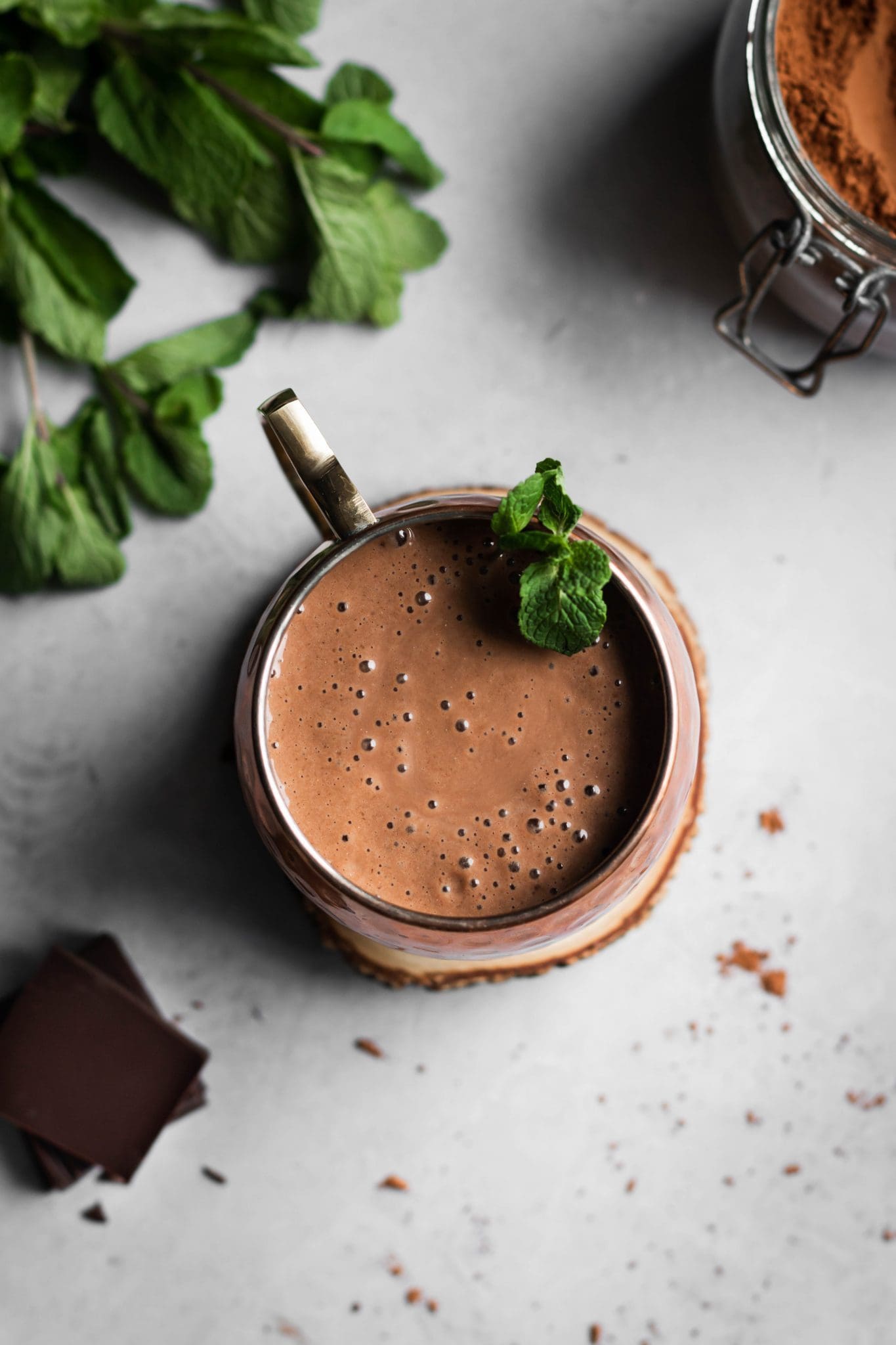 vegan mint chocolate smoothie in a glass from the top