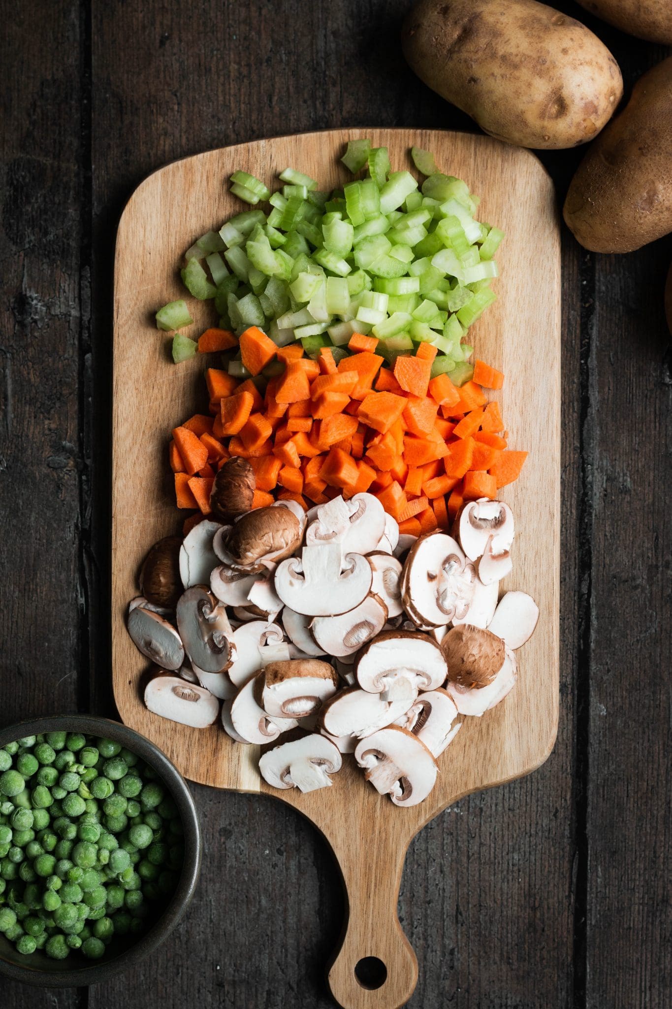 mushrooms, carrots and celery on a cutting board