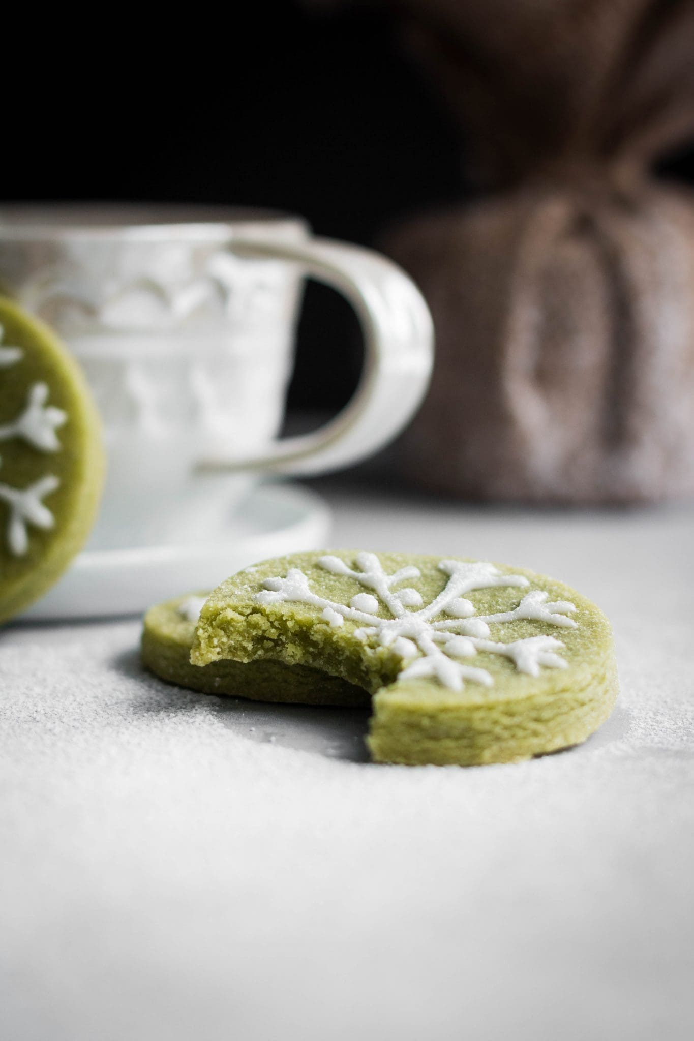 vegan matcha sugar cookie with bite taken