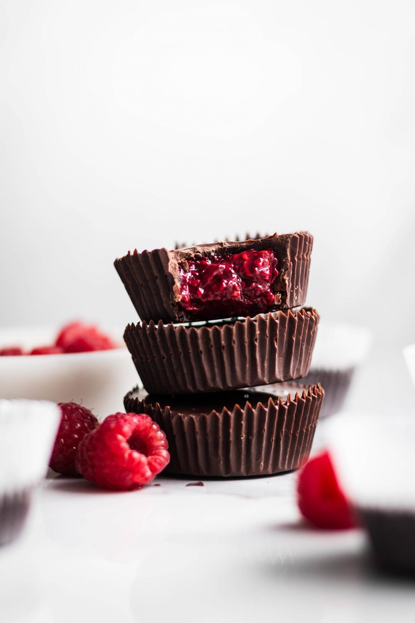 dark chocolate cups with raspberry chia jam