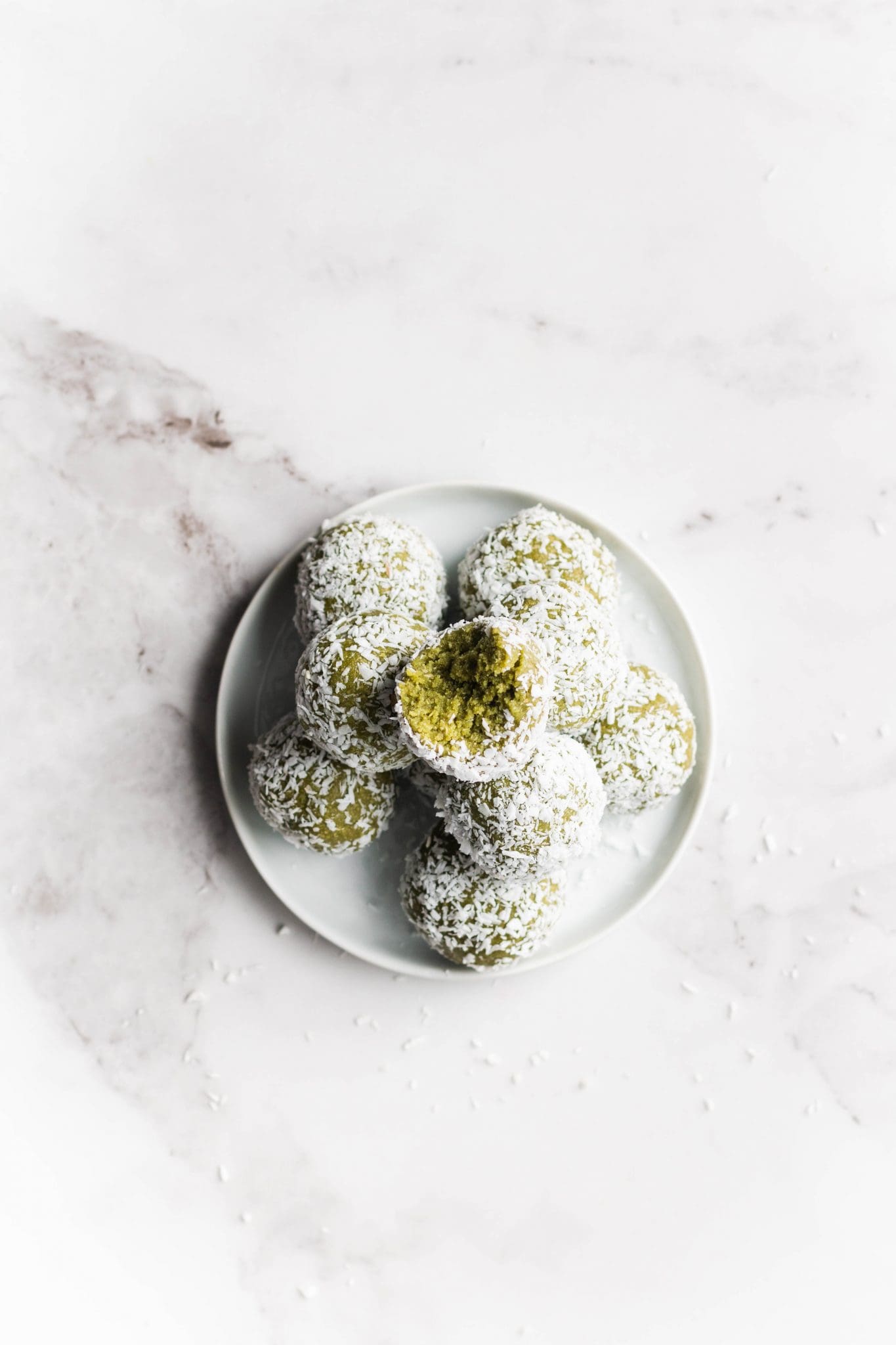 matcha coconut energy bites on a plate from the top