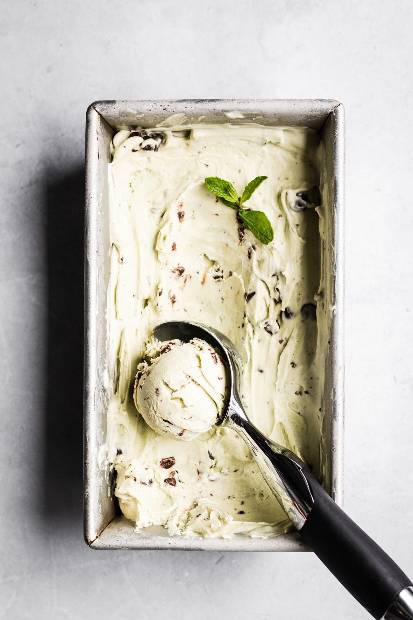 vegan matcha mint chocolate chip ice cream in a loaf pan