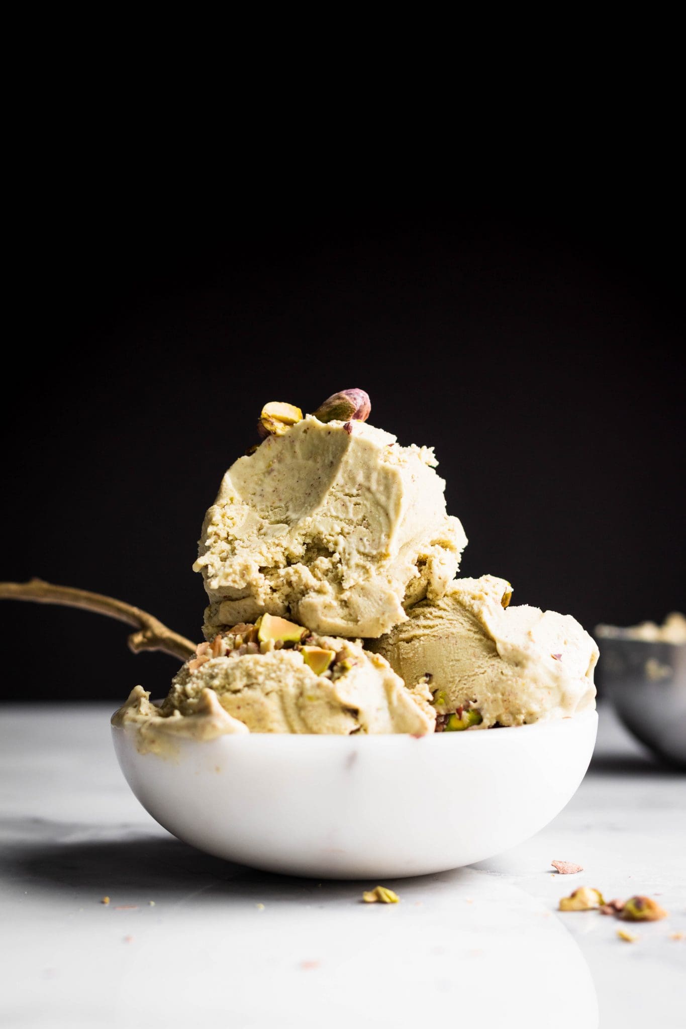 vegan pistachio ice cream with bite taken