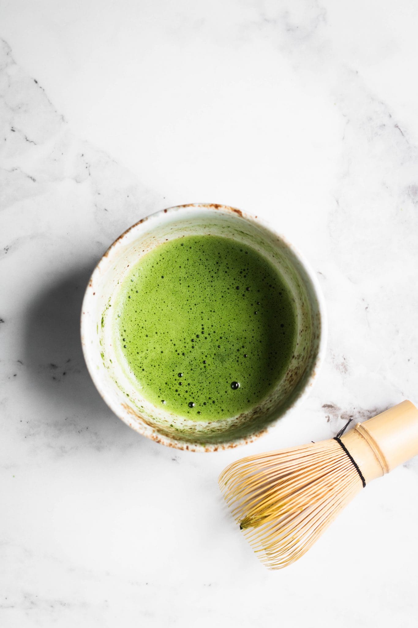 frothy whisked matcha in a bowl