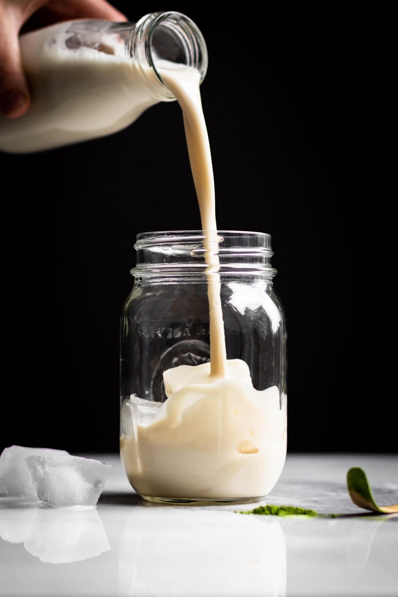 oat milk poured in a jar with ice
