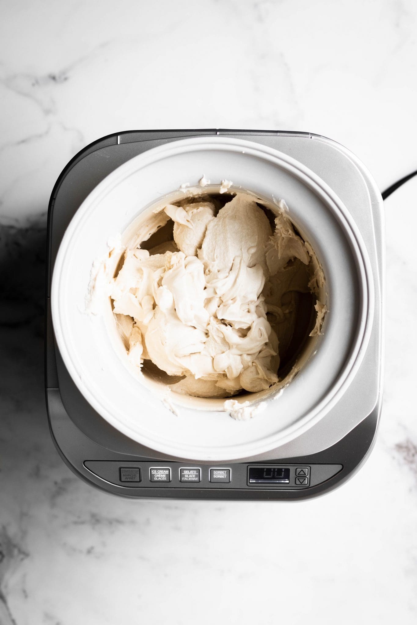 vanilla ice cream in an ice cream maker from the top