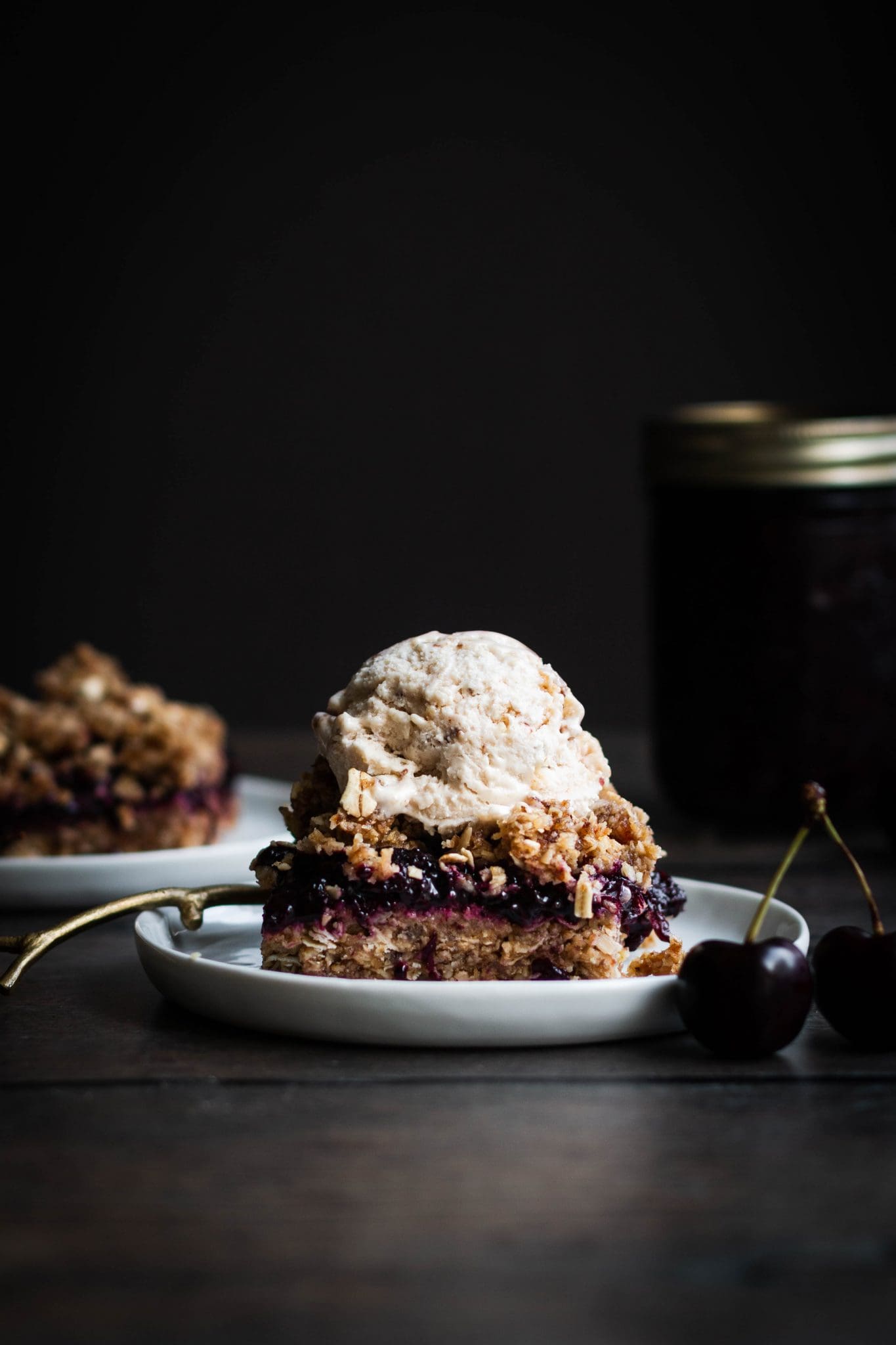 cherry chia jam crumble bar with a scoop of ice cream