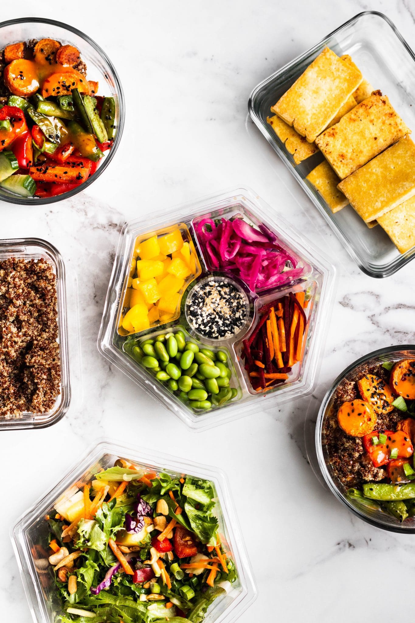 meal prep salad, tofu and quinoa in bowls seen from the top