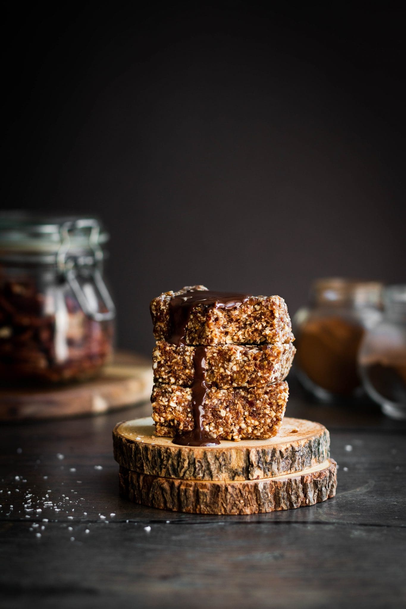 stack of three spiced pecan granola bars with chocolate on top