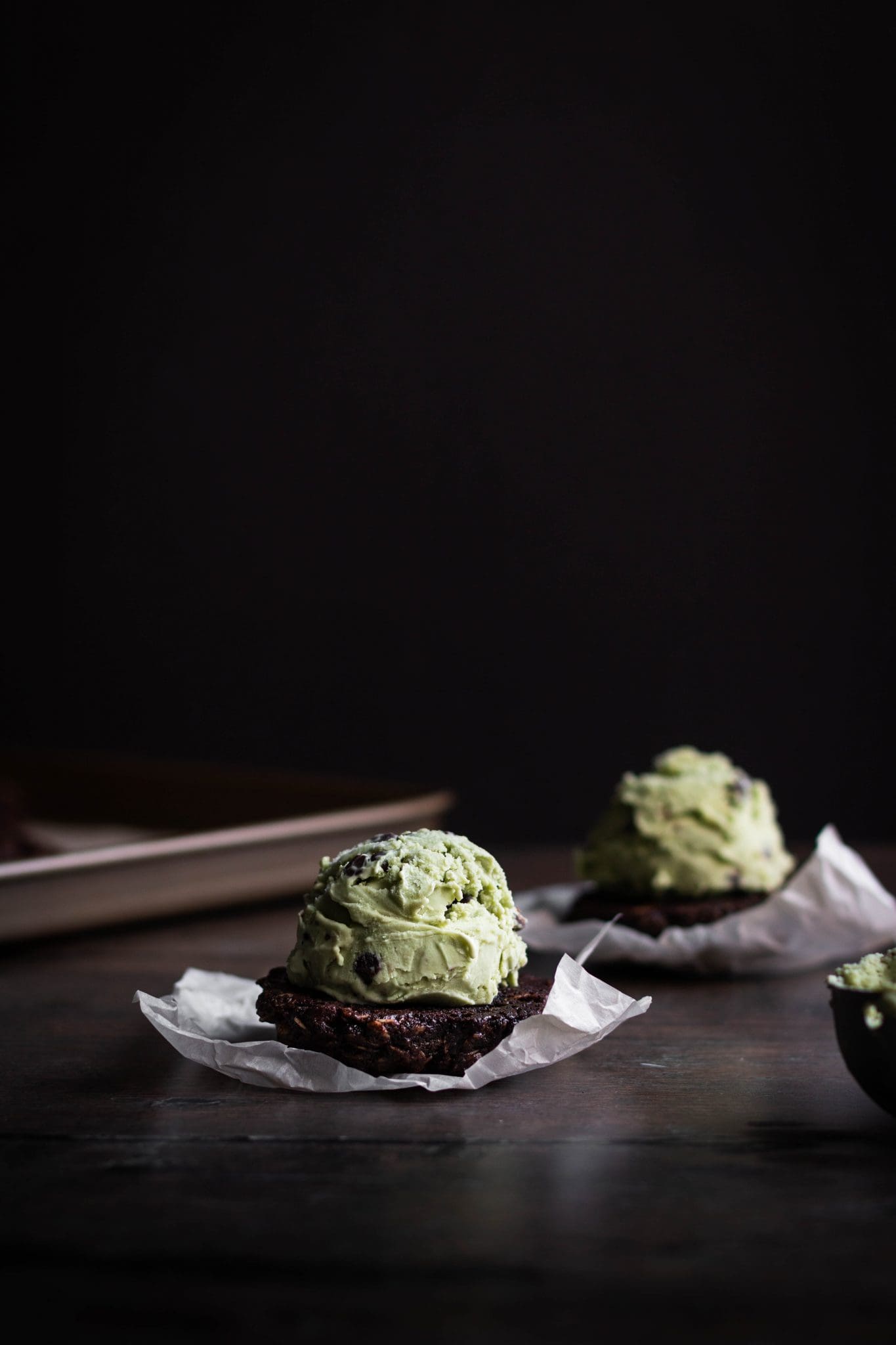 scoop of mint chocolate ice cream on a chocolate cookie